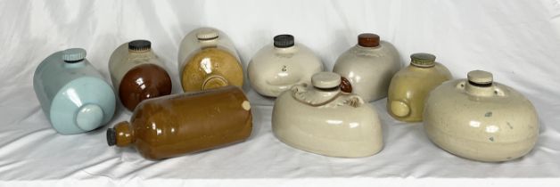 A collection of stoneware hot water bottles and warmers