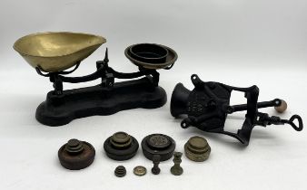 A set of vintage scales and weights along with an antique coffee grinder