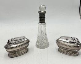 A silver mounted scent bottle along with two silver plated Ronson table lighters