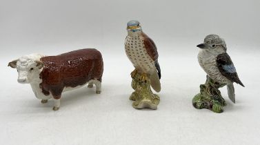 A collection of three Beswick animals comprising of a Kookaburra, Kestrel and Champion of