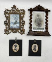 An early 20th century barley twist photo frame dated 1909 along with a Rococo style brass frame