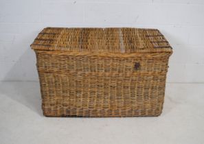 A large wicker laundry basket - length 116cm, depth 61cm, height 70cm