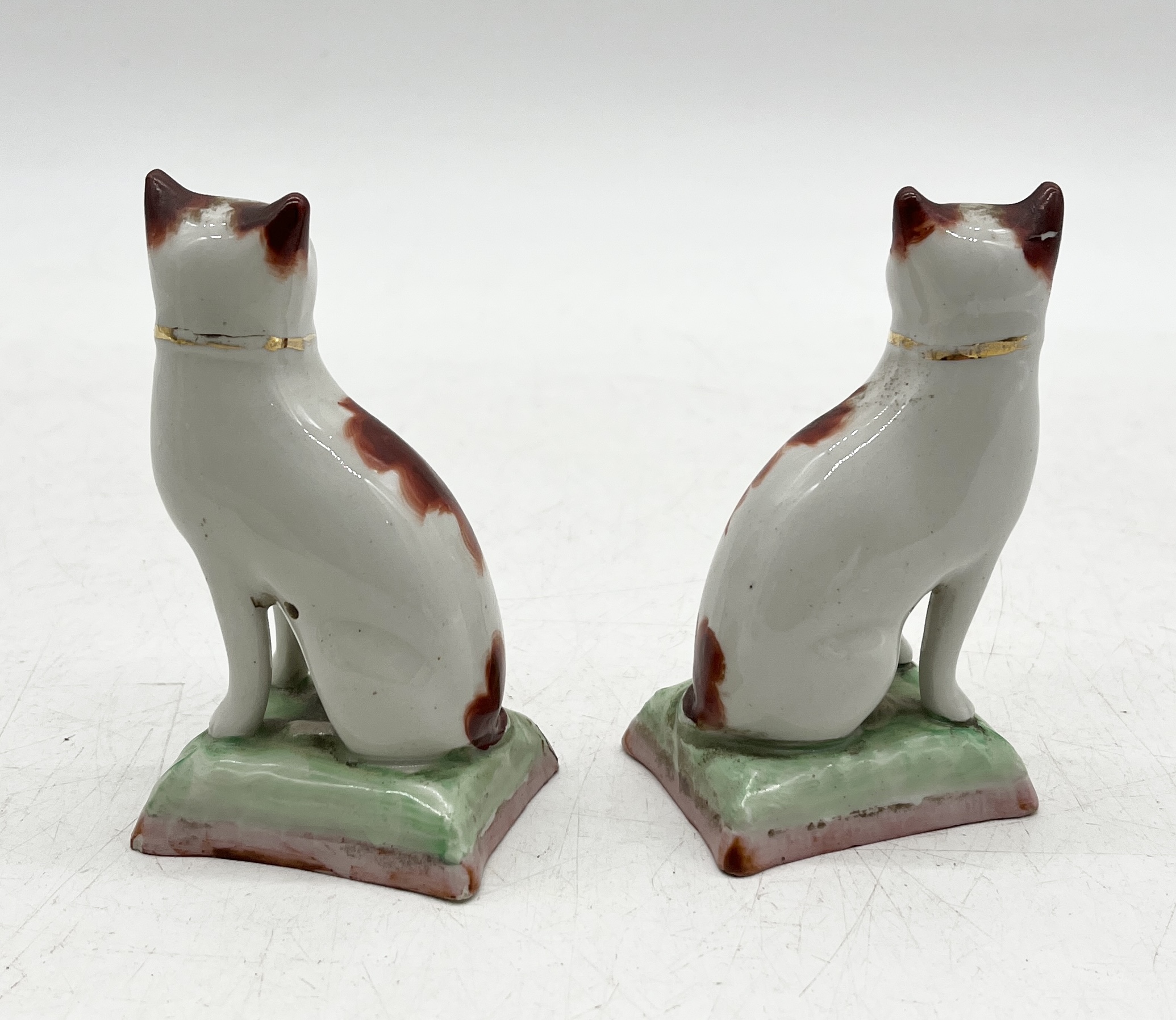 A small Staffordshire figure of a cow along with a pair of Staffordshire cats (1 A/F) - Image 3 of 5