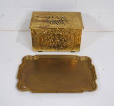 An embossed brass box, along with a large hammered brass tray