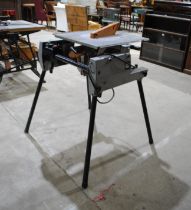 An Elu TGS 173 electric circular table saw - overall size: length 84cm, depth 78cm, height 86cm