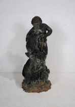 A large weathered bronze figural garden water fountain, in the form of two boys with a fish and a