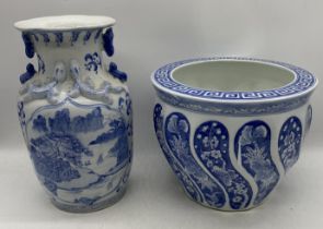 A Chinese blue and white fish bowl with character marks to underside along with a Chinese vase (
