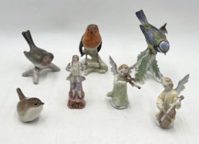 A collection of ceramics including Goebel birds, continental cherubs etc.