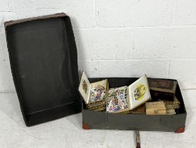 A large collection of loose stamps within a vintage case