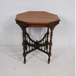 A turn of the century mahogany octagonal table, with turned supports - length 68cm, depth 66cm,