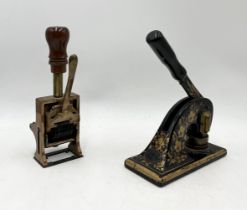 A Jordan & Sons Ltd. cast iron stamp along with vintage wooden handled number stamp