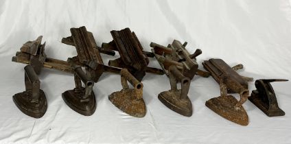 A collection of antique plough planes including John Boseley & Son, along with a number of flat