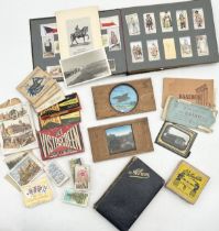 A collection of various items including cigarette cards, magic lantern slides, autograph book,