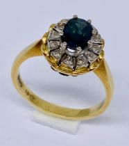 An 18ct gold cluster ring set with sapphire and diamonds, size P 1/2