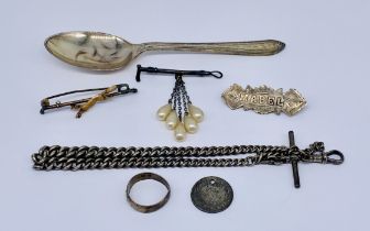 A small collection of hallmarked silver items including an Albert, brooch, spoon etc.