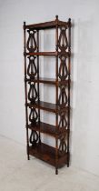 A Victorian style mahogany six tier whatnot, with lyre sides, turned supports and two small