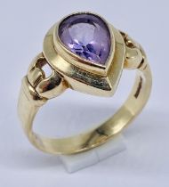 A 9ct gold ring set with a teardrop shaped amethyst, size P