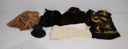 A quantity of vintage clothing, including a collapsable top hat by 'Bennetts' of London, a fur wrap,