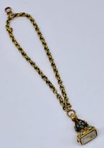 A tested 18ct gold seal set with turquoise (2 stones missing) on 18ct gold chain with 9ct gold