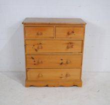 A pine chest of five drawers - length 86.5cm, depth 44.5cm, height 97cm