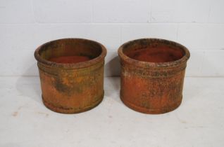 A pair of large weathered terracotta garden pots of cylindrical form - diameter 50cm, height 39cm