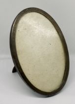 An oval hallmarked silver photo frame