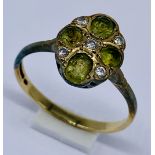A diamond and peridot cluster ring set in 9ct gold, size M 1/2