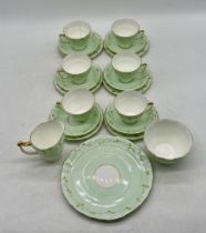 A Sampson Smith Old Royal china part tea set including six trios, bowl, creamer, plate. One cup