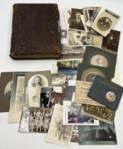 A collection of photographs, postcards and ephemera including Victorian photograph album