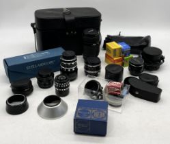 A collection of various camera lenses including Nikon Nikkor 70-120mm, Meyer-Optik, Vario Macro