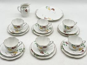 A Taylor & Kent part tea set decorated with hand painted floral design