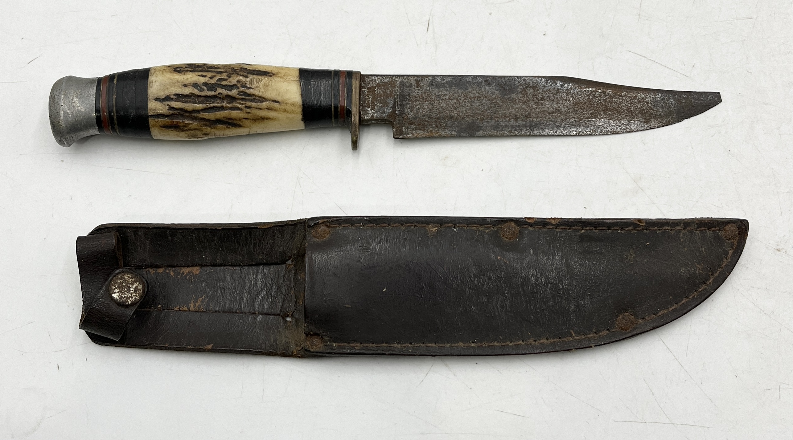 A William Rodgers bone handled hunting knife with leather sheath