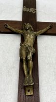 A wooden crucifix 26cm x 47cm with brass Corpus and INRI scroll