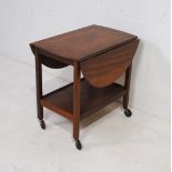 A mid century drop-leaf tea trolley