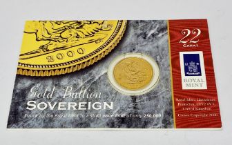 A carded full sovereign dated 2000