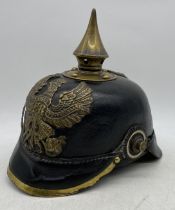 A WWI First World War style Imperial German / Prussian Army 1860 pattern pickelhaube helmet. Leather