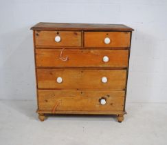 A Victorian pine chest of five drawers - two ceramic handles loose but present - length 108cm, depth