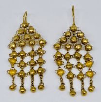 A pair of Arabic style gold earrings- tests as 14-18ct gold, total weight 12.3g