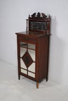 An Edwardian mahogany music cabinet, named to 'Matthew Rose & Sons of Hackney, N.E', with single