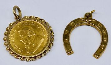 A 1/10 oz Krugerrand in 9ct gold pendant mount (gross weight 4.2g) along with a 9ct gold horseshoe