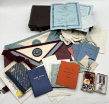 A collection of Masonic regalia and ephemera including aprons, jewels, lodge documents etc.