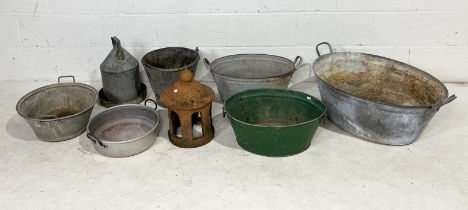 A collection of galvanised items including baths, buckets, chicken feeder etc.