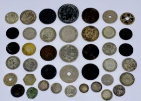 A collection of coins including a Charles II fourpence, Napoleon Expostion medallion, Roman coin