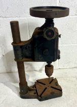 A vintage manual pillar drill.