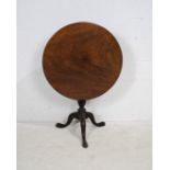 A Georgian mahogany circular tilt-top tripod table, with hoof feet - diameter 74cm, height 71cm