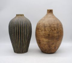 Two large Indonesian gourd vases - tallest 44cm