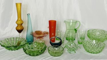 A collection of various glassware including green glass bowls, lemonade set, art glass vases etc.