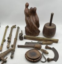 An assortment of miscellaneous items including three vintage wooden and brass garden sprayers,