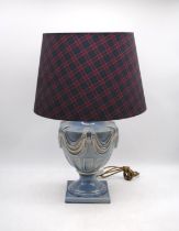 A blue ground ceramic urn shaped table lamp, with shade