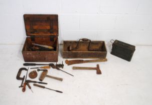 Two vintage wooden crates containing various tools, along with an ammo crate